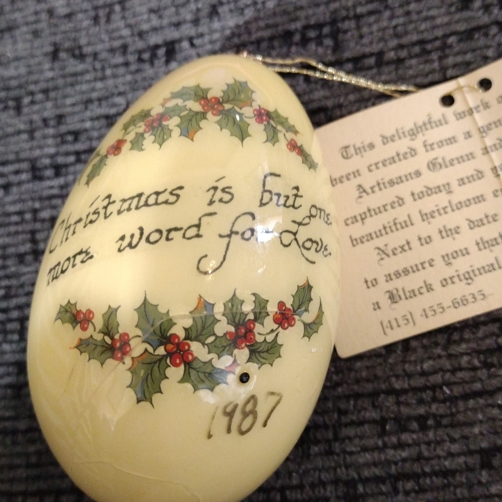 A Black original Artisan Christmas Ornament with Holly Design. 1987
